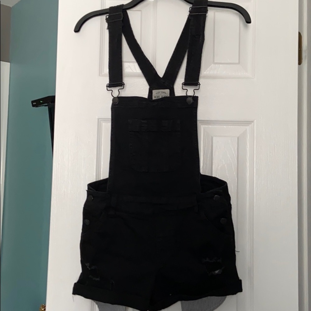 Junior’s black overalls